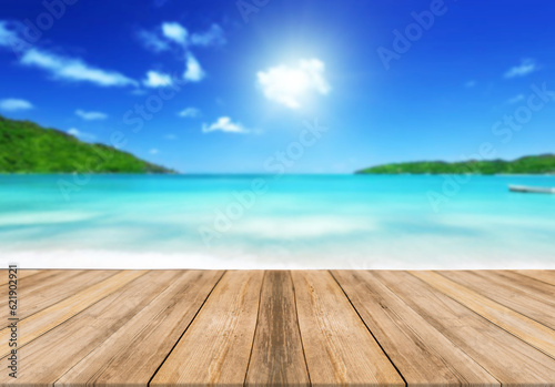 Top of wood table with seascape  blur bokeh light of calm sea and sky background. Empty ready for your product display montage. summer vacation background concept.