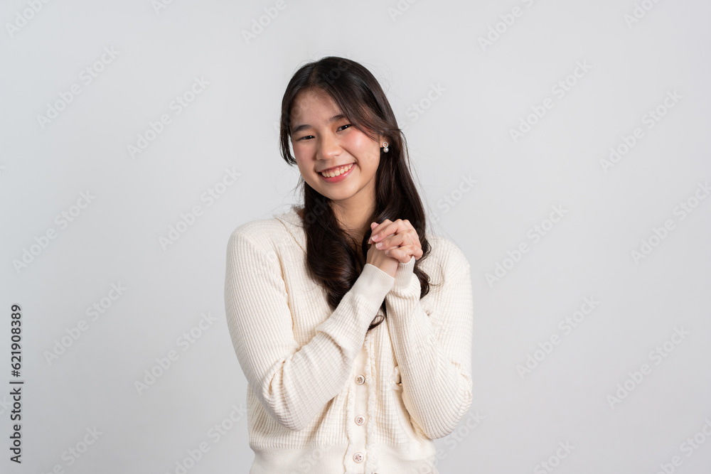Happy cheerful young Asian girl with long light hair smiling brightly feeling happy with a positive expression, joyful surprise funky, Female in black with a big smile isolated on white background. Happy cheerful young Asian girl with long light hair smiling brightly feeling happy with a positive expression, joyful surprise funky, Female in black with a big smile isolated on white background.