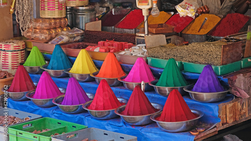 Rangoli powder, incense and joss sticks on display in an Indian market. The colourants are used in Hindu forehead marking and for festivals such as Holi as well as for making patterns, known as Kolams © pjhpix
