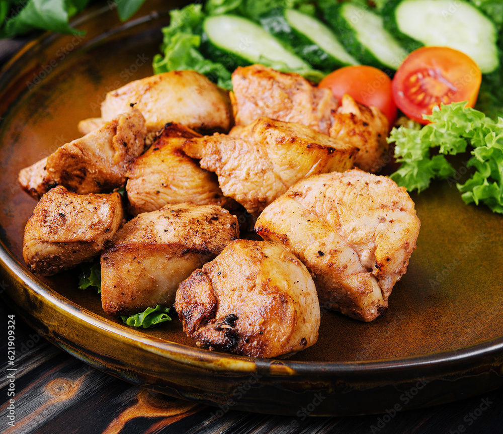 Grilled chicken and salad in a ceramic bowl Grilled chicken and salad in a ceramic bowl
