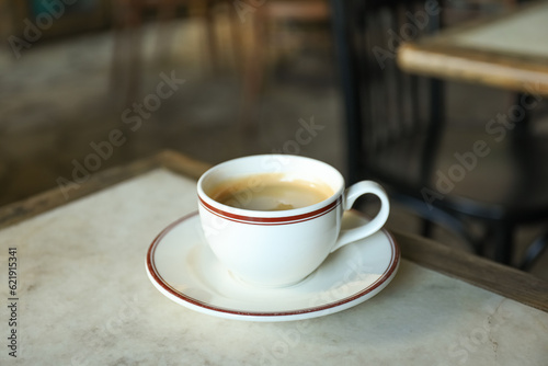 A cup of coffee on a table in a cafe