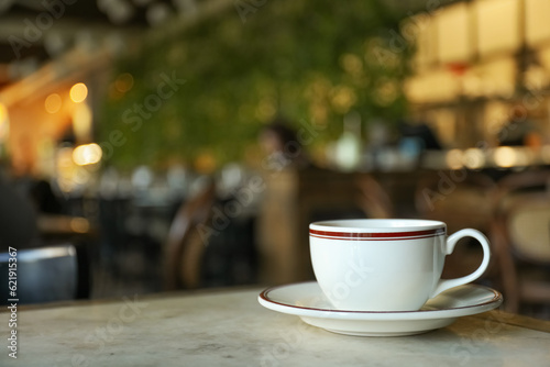 A cup of coffee on a table in a cafe