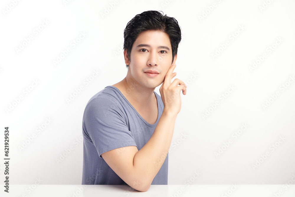 handsome young asian man on white background, Face care, Facial treatment, Cosmetology, beauty and spa, Asian men portrait. handsome young asian man on white background, Face care, Facial treatment, Cosmetology, beauty and spa, Asian men portrait.