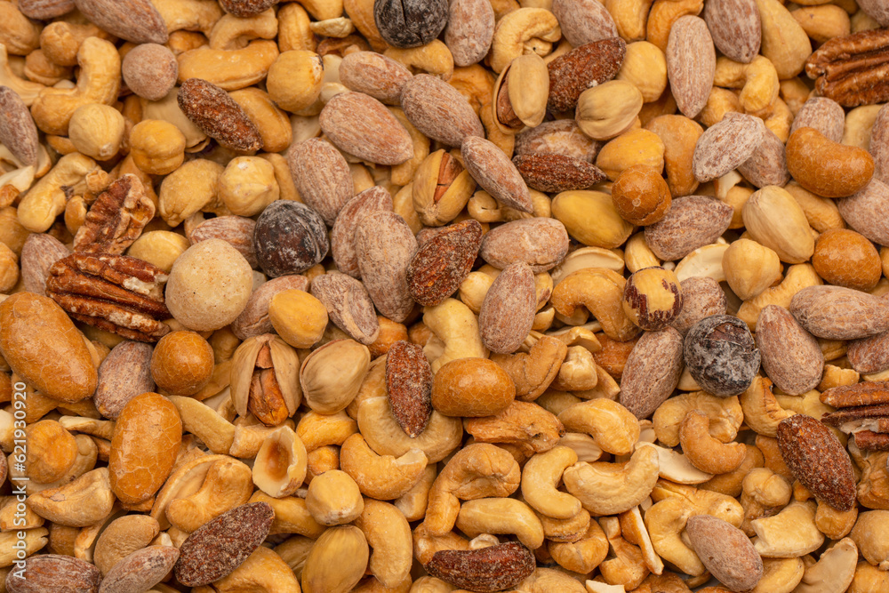 A group of almonds, pistachios, walnuts, macadamia, cashews. A group of almonds, pistachios, walnuts, macadamia, cashews.