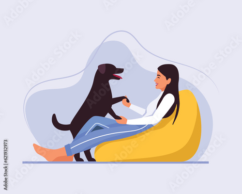 light-skinned girl with long hair sits on a bean bag chair with a dog