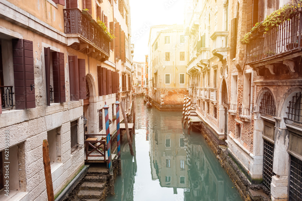 Narrow canal in Venice, Italy with boats