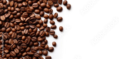 Roasted coffee beans spread over white background