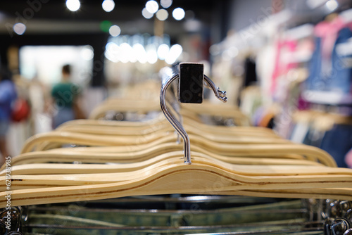 Hangers in the store, close-up selective focus. © Oleg Kozlovskiy