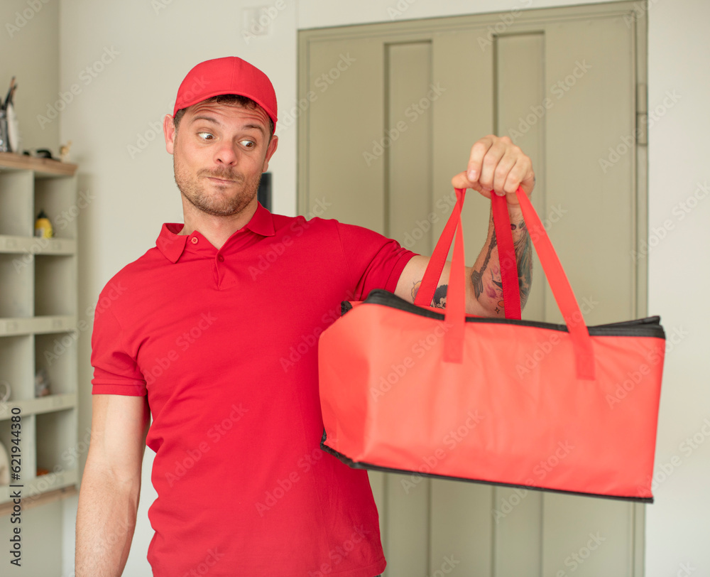 smiling and looking with a happy confident expression. pizza delivery take away smiling and looking with a happy confident expression. pizza delivery take away