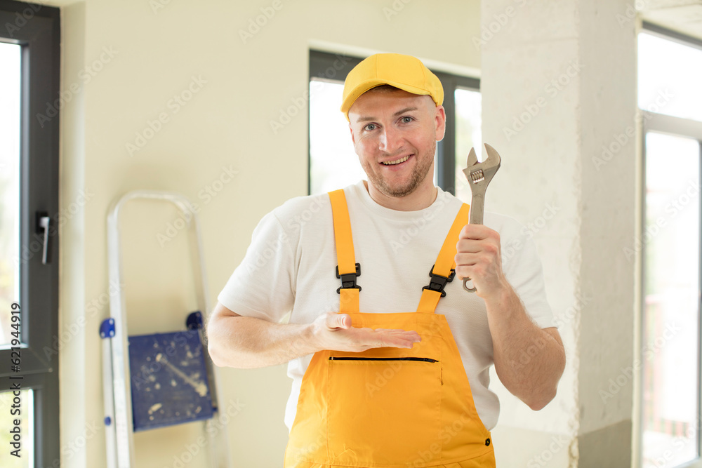 smiling cheerfully, feeling happy and showing a concept. handyman concept smiling cheerfully, feeling happy and showing a concept. handyman concept