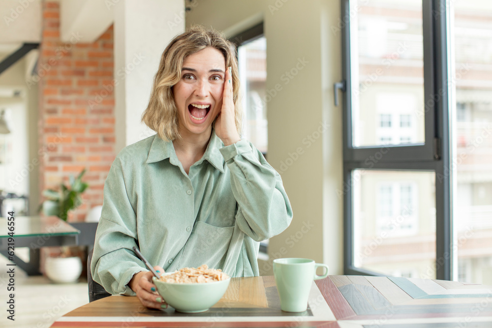 pretty woman feeling happy and astonished at something unbelievable. breakfast bowl concept pretty woman feeling happy and astonished at something unbelievable. breakfast bowl concept