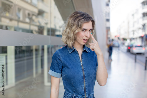 Photography pretty woman keeping an eye on you, not trusting, watching and staying alert and