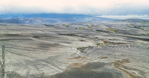 Aerial view of the western slope of Hekla volcano covered with tephra and mountain Burfell, rotating, Iceland. photo