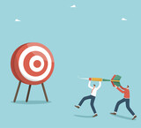 Collaboration and partnership in achieving goals, accuracy in setting and planning business strategies, teamwork in solving work tasks, motivation for great success, two men throw a dart at a target.