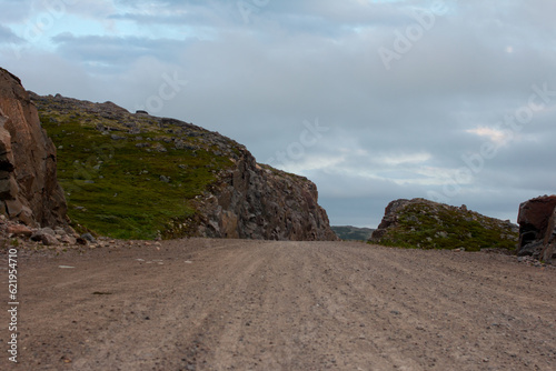 The road in the rock. A dangerous road through the rocks in the north