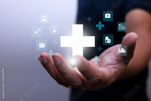 Businessman with medical icons in a hand. analysis technology equipment medicine healthy, business and healthcare concept.
