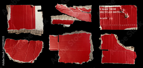 Foto Set of ripped red cardboard pieces isolated on black background