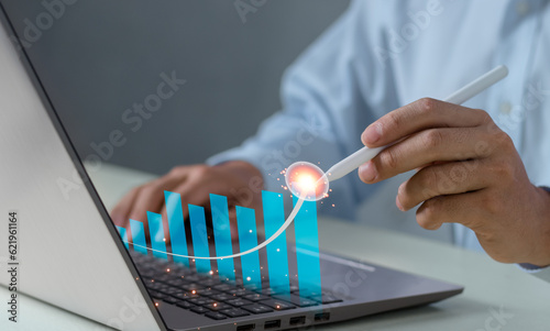 Business analysis, financial investment and technology concept. development to success and growing growth, analyzing financial graph on virtual screen..