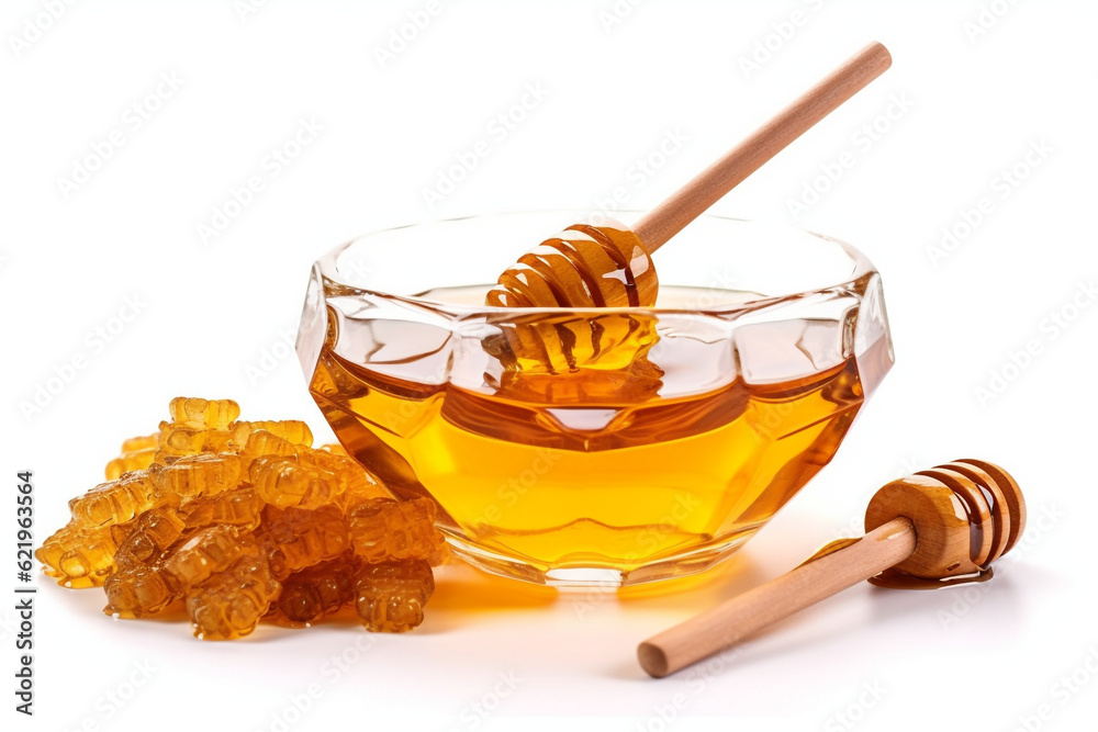 Honeycomb and honey in glass bowl and spoon, flower isolated on white background Honeycomb and honey in glass bowl and spoon, flower isolated on white background