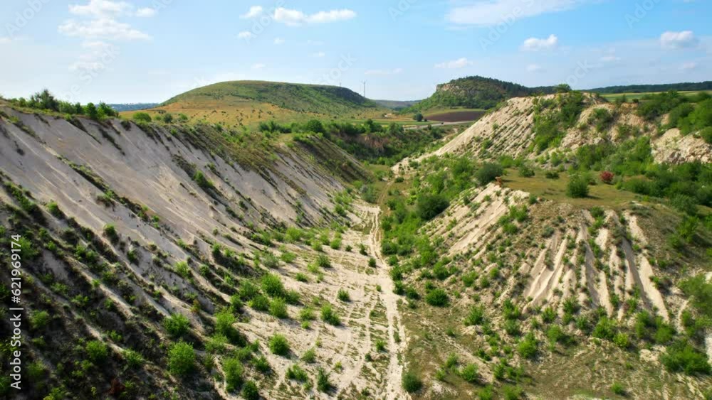 Aerial drone view of the Little Switzerland of Moldova located in Fetesti. Former limestone quarry with slopes covered with greenery Aerial drone view of the Little Switzerland of Moldova located in Fetesti. Former limestone quarry with slopes covered with greenery