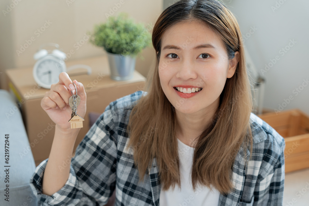 Moving house, relocation. Woman hold key house keychain in new apartment. move in new home. Buy or rent real estate. flat tenancy, leasehold property, new landlord, dwelling, loan, mortgage. Moving house, relocation. Woman hold key house keychain in new apartment. move in new home. Buy or rent real estate. flat tenancy, leasehold property, new landlord, dwelling, loan, mortgage.