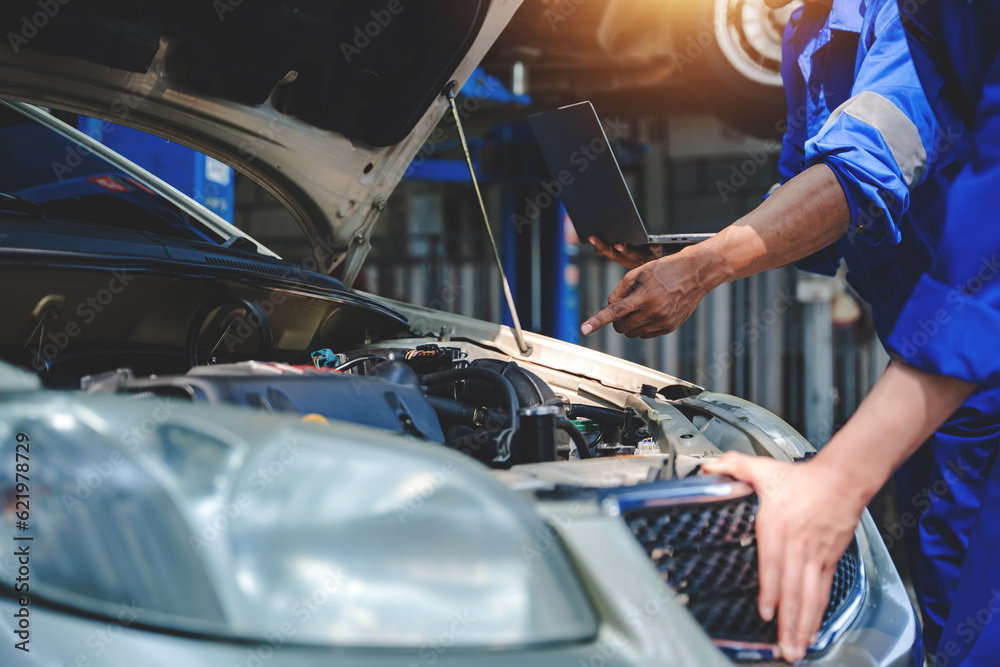 Mechanic inspects and maintains the engine for the customer. An app to write checklists for repair machines, car services and maintenance to the clipboard.