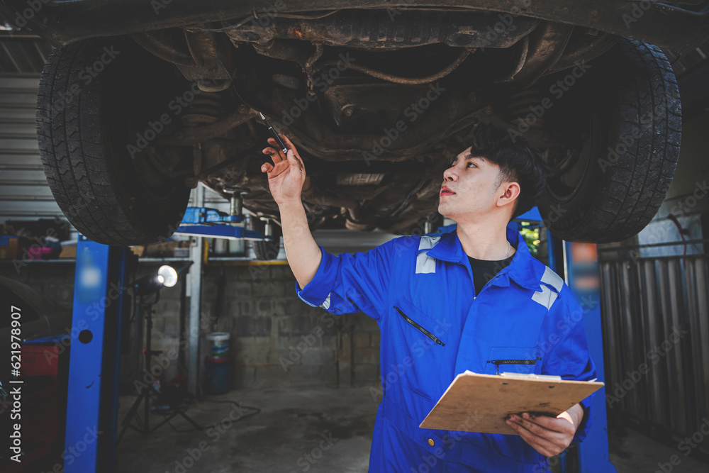 Mechanic inspects and maintains the engine for the customer. An app to write checklists for repair machines, car services and maintenance to the clipboard. Mechanic inspects and maintains the engine for the customer. An app to write checklists for repair machines, car services and maintenance to the clipboard.