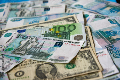 background of paper bills dollars, euros and rubles. Currency exchange rate