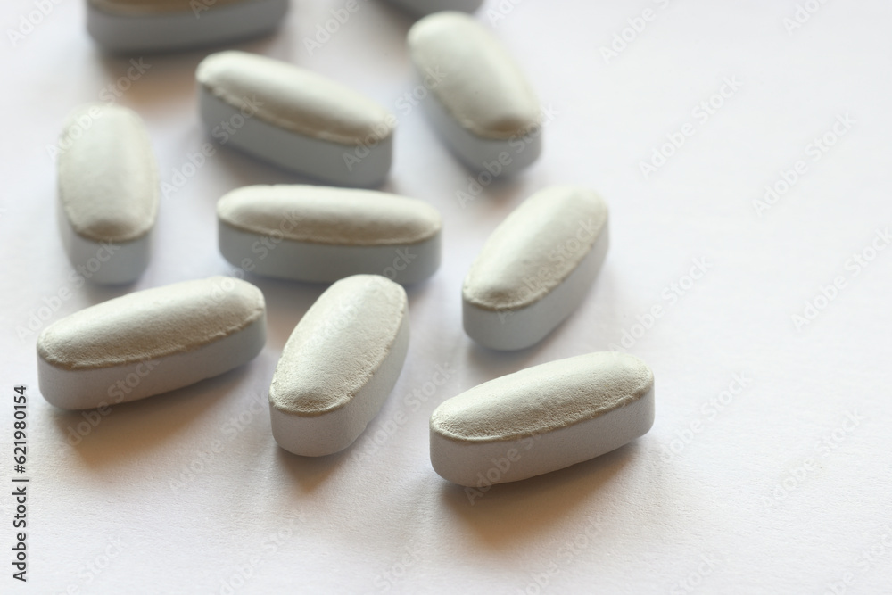 Detail of blue pills in packaging and isolated Detail of blue pills in packaging and isolated