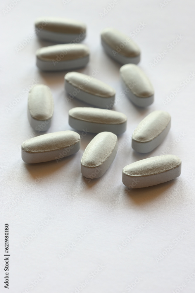 Detail of blue pills in packaging and isolated Detail of blue pills in packaging and isolated