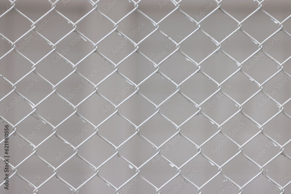 Fototapeta premium wire fence on the white wall background.