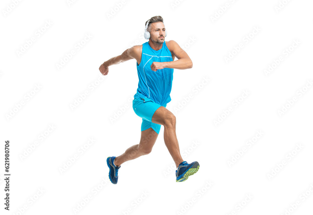 concentrated jogger stretched legs before running. sport jogger listen to music in headphones. The jogger ran at sport training isolated on white. In a morning sport workout jogger run in studio