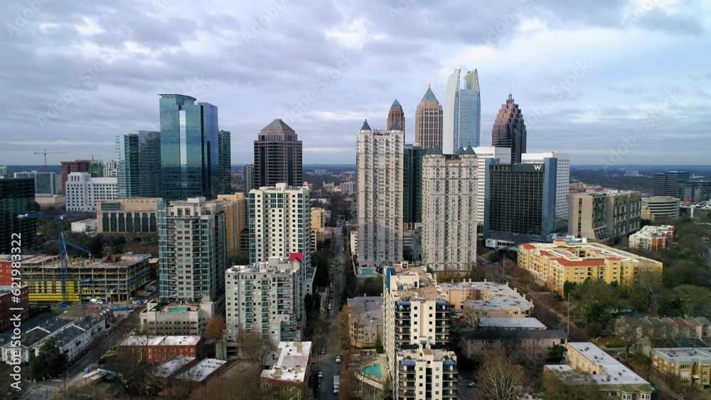 Aerial Shot Of Vehicles On Streets Amidst Buildings In City, Drone Flying Backward Over Cityscape Against Cloudy Sky - Atlanta, Georgia Aerial Shot Of Vehicles On Streets Amidst Buildings In City, Drone Flying Backward Over Cityscape Against Cloudy Sky - Atlanta, Georgia