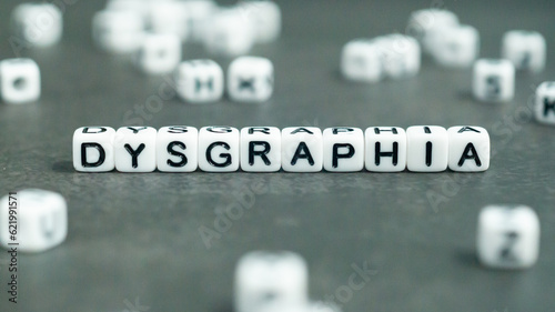 Dysgraphia word in white letter block beads. Front view. Dysgraphia concept. 