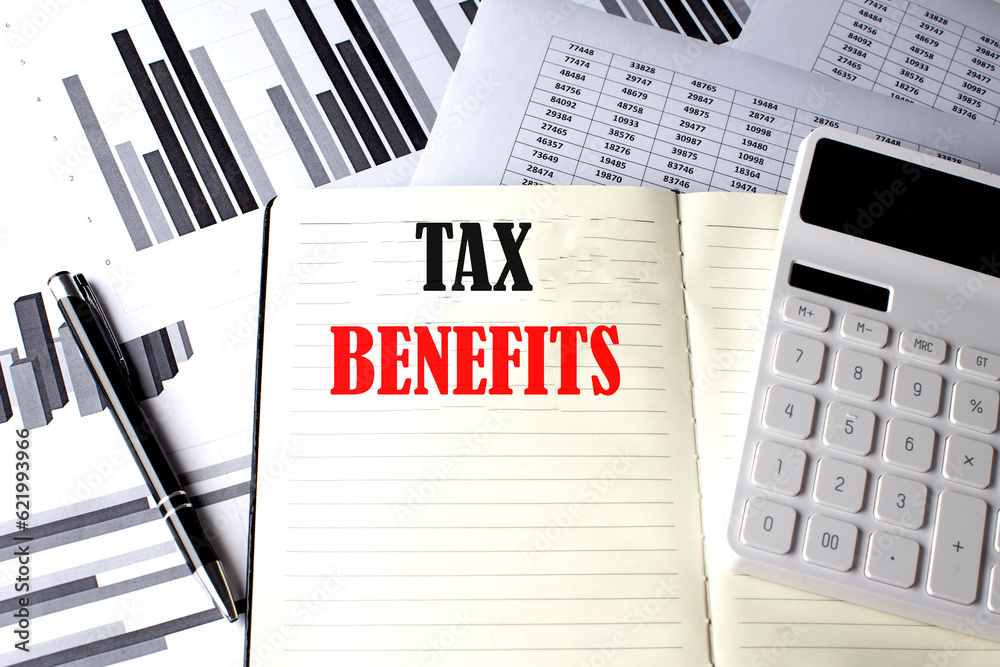TAX BENEFITS text written on a notebook on chart and diagram TAX BENEFITS text written on a notebook on chart and diagram