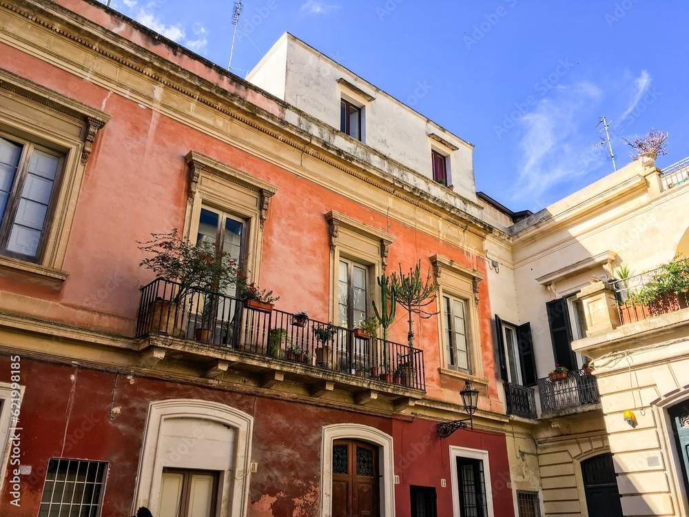 Balcony of a historical holiday house in Lecce, Italy with blue sky