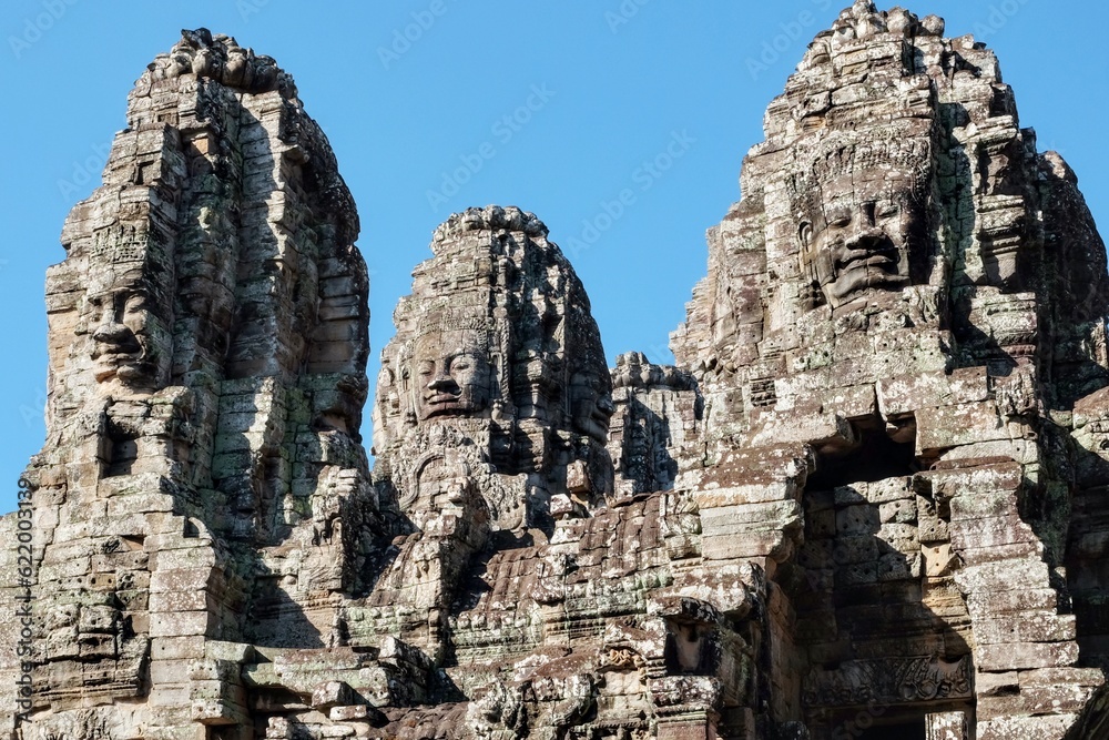 Stone human faces featured on the towers of Cambodia's Khmer Bayon Temple.