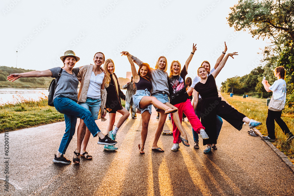 Obraz premium dancing cheerful attractive women at sunset. 