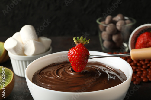 Concept of tasty and sweet food - chocolate fondue