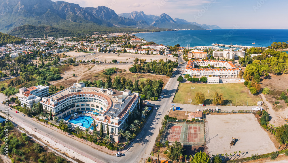 picturesque village resort Kemer in Turkey, boasting an enticing swimming pool, a stunning panoramic view from above.