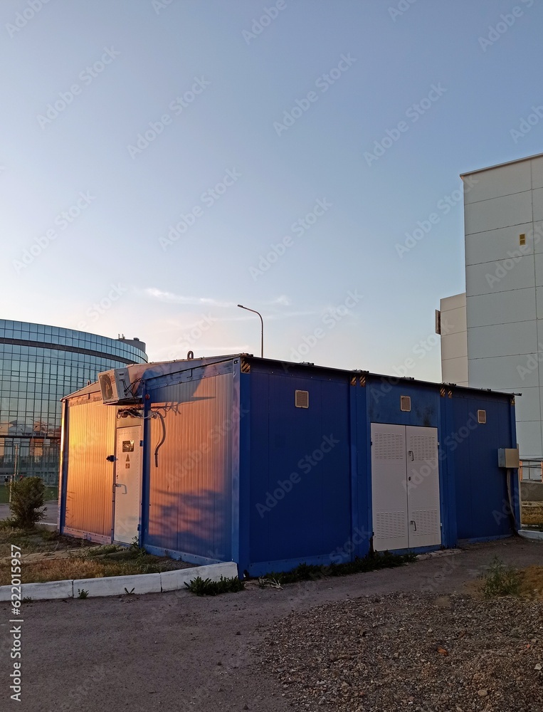 blue iron garage at sunset