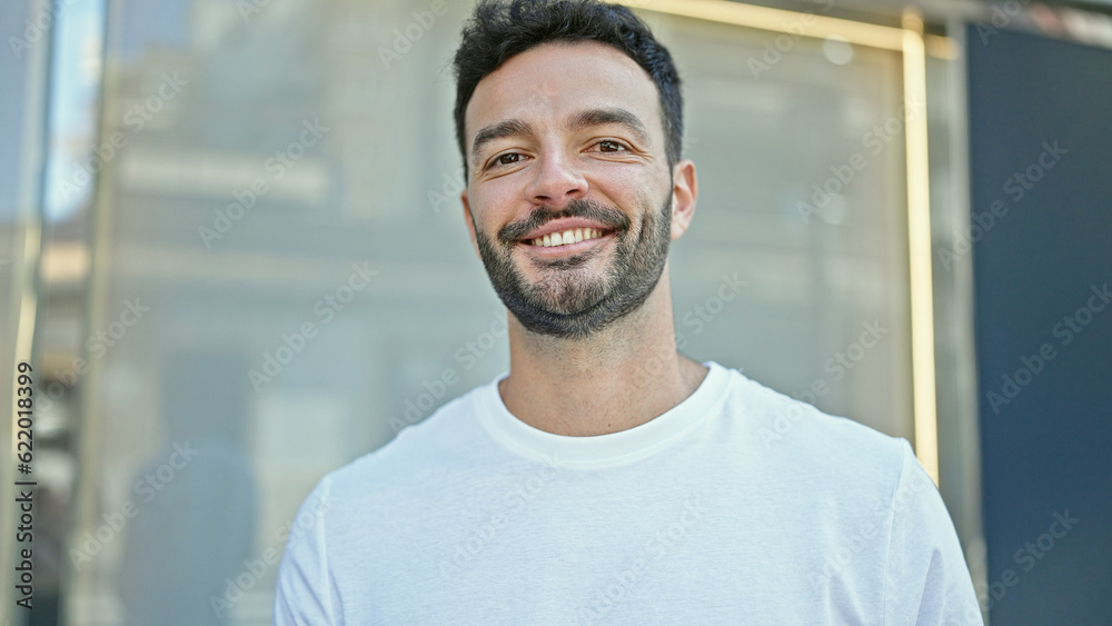 Young hispanic man smiling confident standing at street Young hispanic man smiling confident standing at street