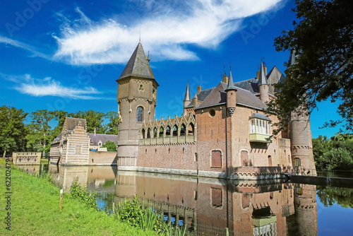 Beautiful romantic medieval dutch moated water castle, green garden park - Kasteel Heeswijk, Netherlands photo