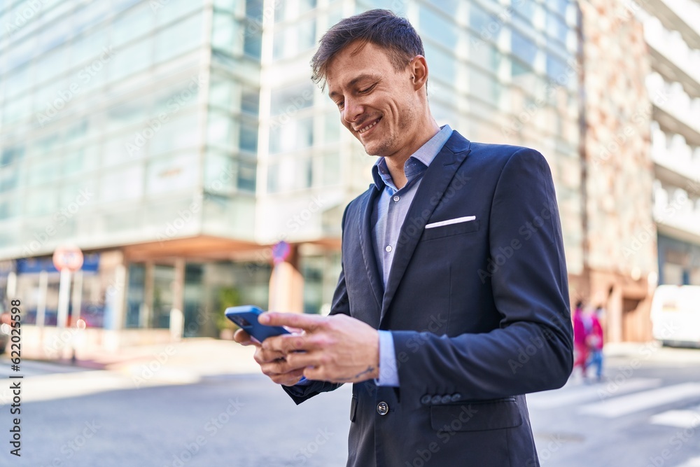 Young man business worker smiling confident using smartphone at street Young man business worker smiling confident using smartphone at street