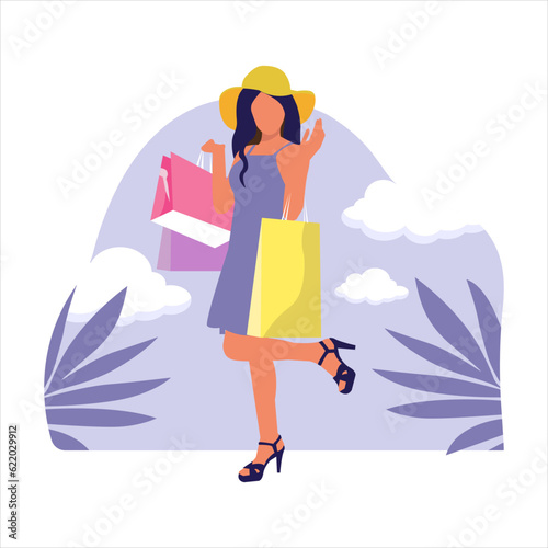 Young attractive fashionable woman holding packages with clothes after shopping.