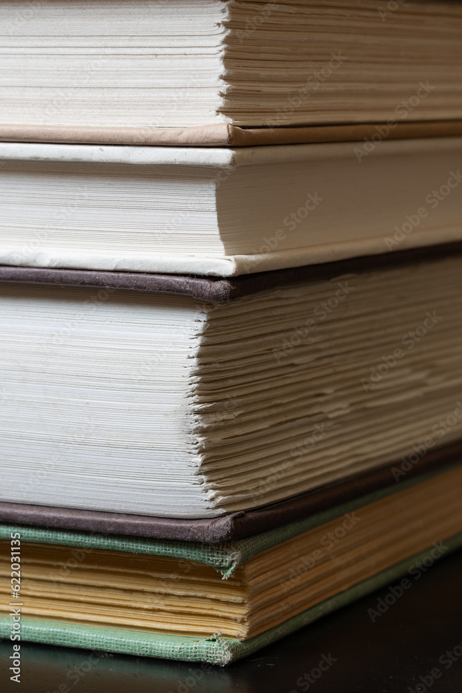 Angular macro photo of stack of hardcover books Angular macro photo of stack of hardcover books