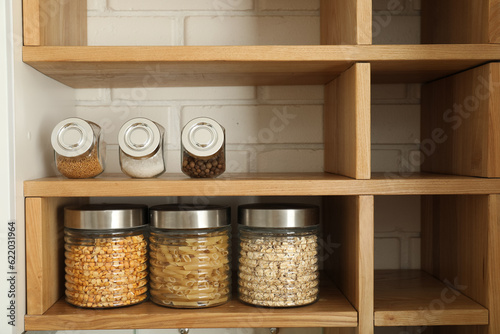 Spices in the kitchen in jars, on open shelves