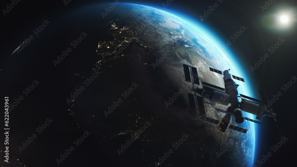 Earth globe rotating in outer space. Satellite or ISS flies in planet orbit. View of the night cities lights from space. Day-night transition. Discovery and exploration concept.