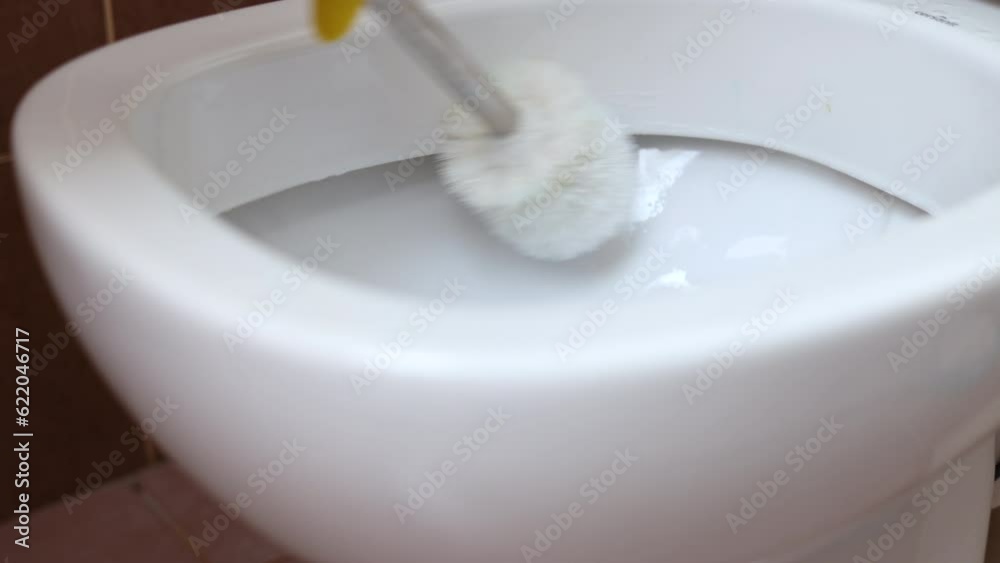 woman cleaning toilet wc with brush and cleaner gel, putting deodorant hanger deodorizer, flushing water. hand in glove using cloth. close up 4k woman cleaning toilet wc with brush and cleaner gel, putting deodorant hanger deodorizer, flushing water. hand in glove using cloth. close up 4k
