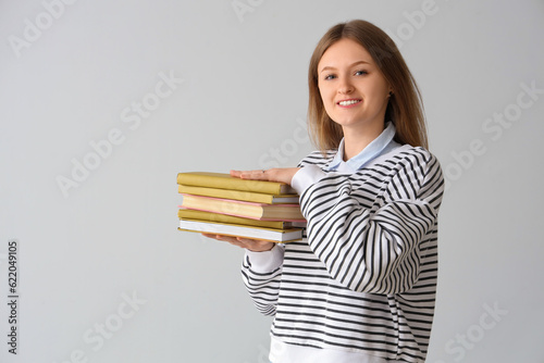 Happy female student with s...